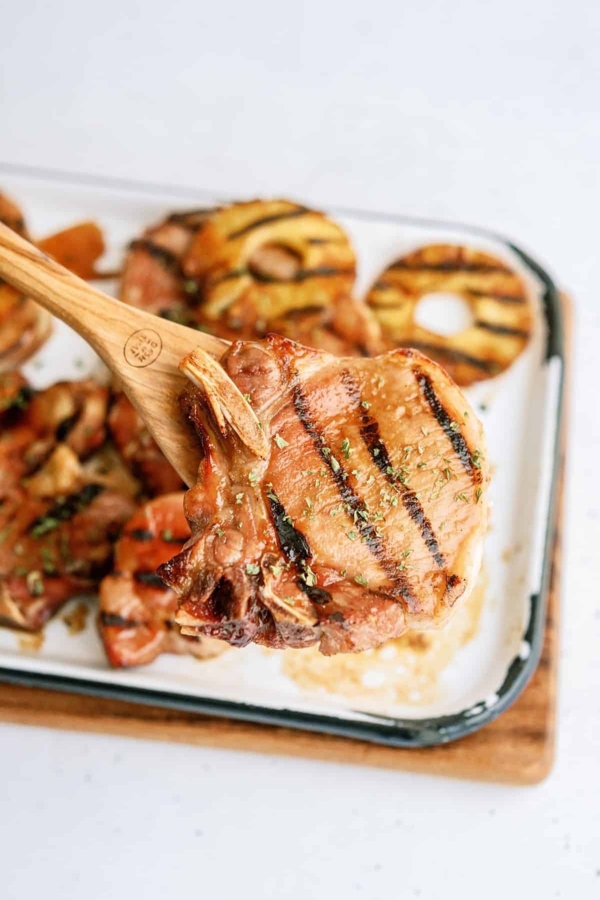 Grilled Hawaiian Pineapple Pork Chop on a baking sheet