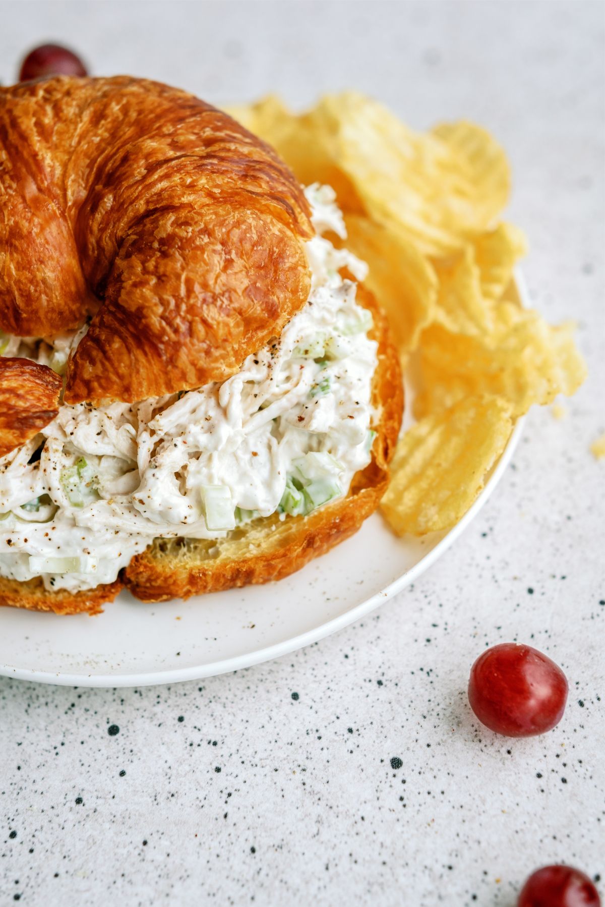 Kneaders Copycat Chicken Salad on a croissant bun with side of chips