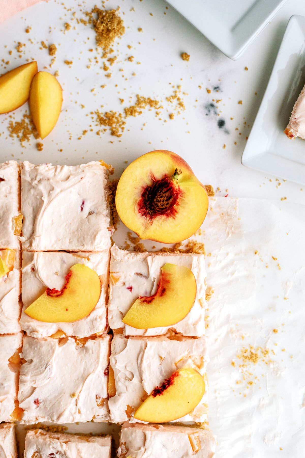 Top view of No-Bake Peach Cheesecake Bars cut into squares