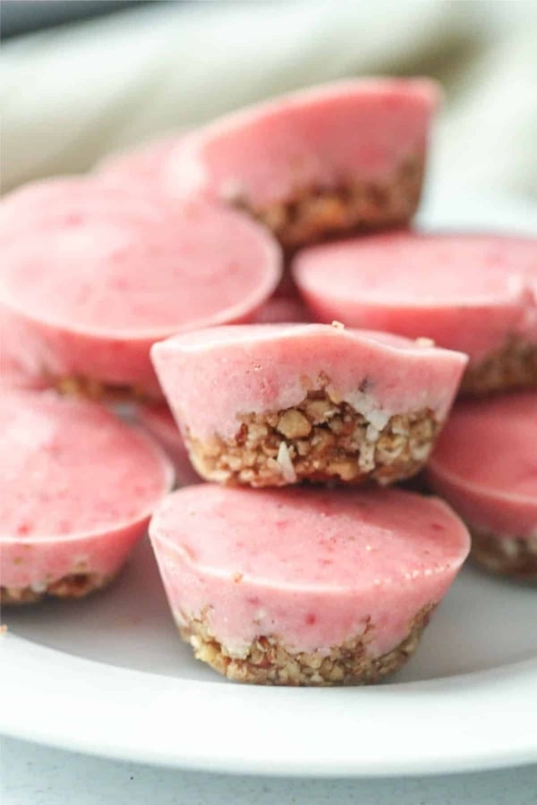 Skinny Frozen Strawberry Bites stacked on a plate