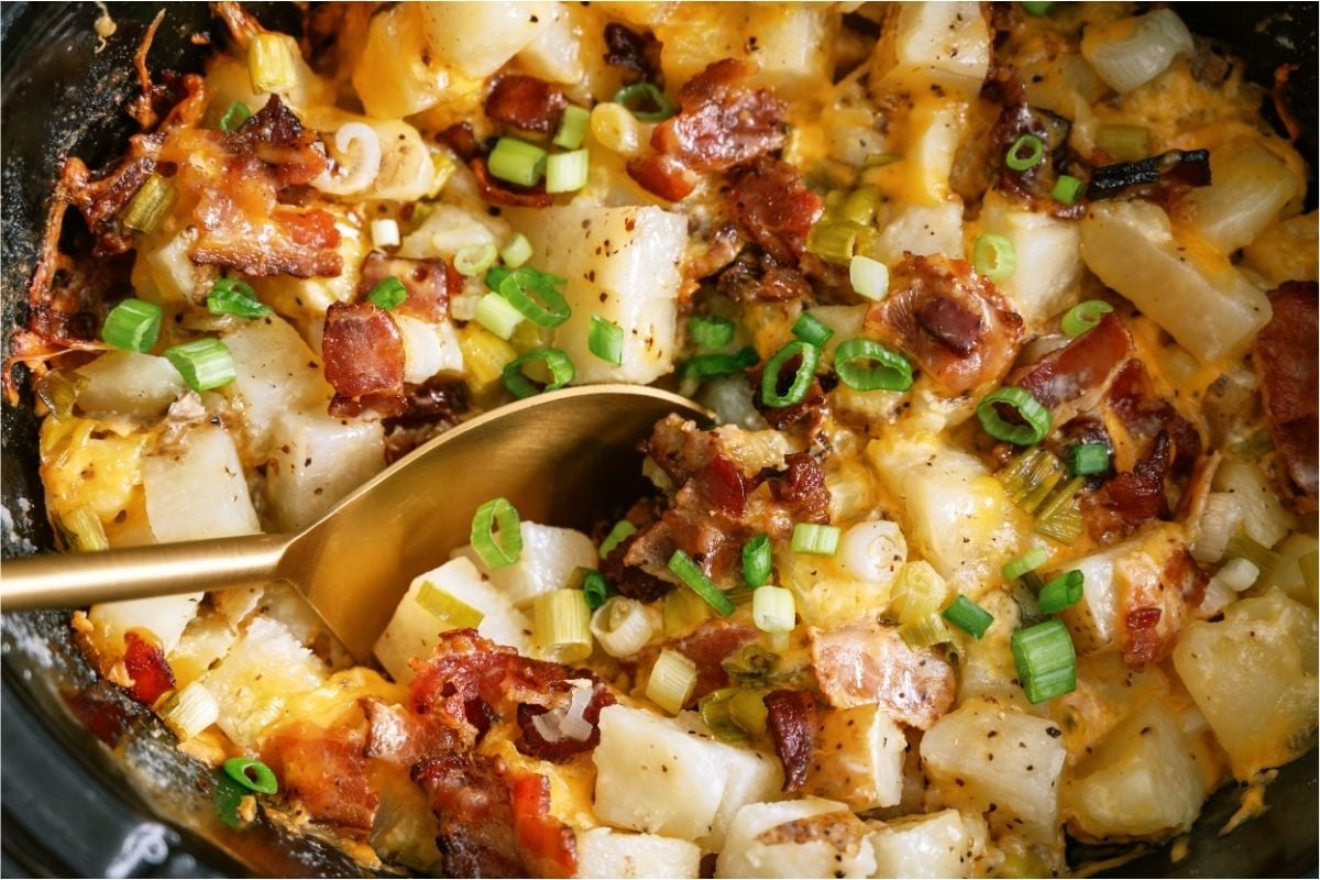Close up of Slow Cooker Loaded Chicken and Potato Casserole with a spoon.