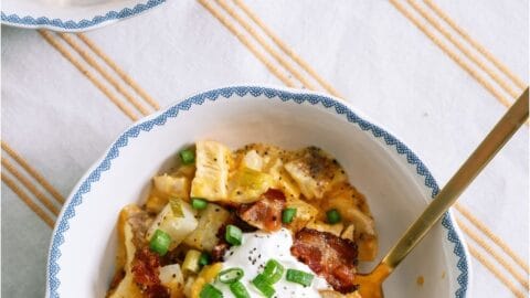 Top view of a bowl of Slow Cooker Loaded Chicken and Potato Casserole topped with sour cream.