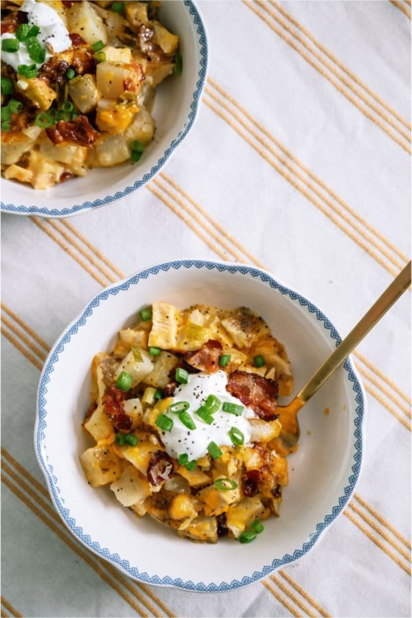 Top view of a bowl of Slow Cooker Loaded Chicken and Potato Casserole topped with sour cream.