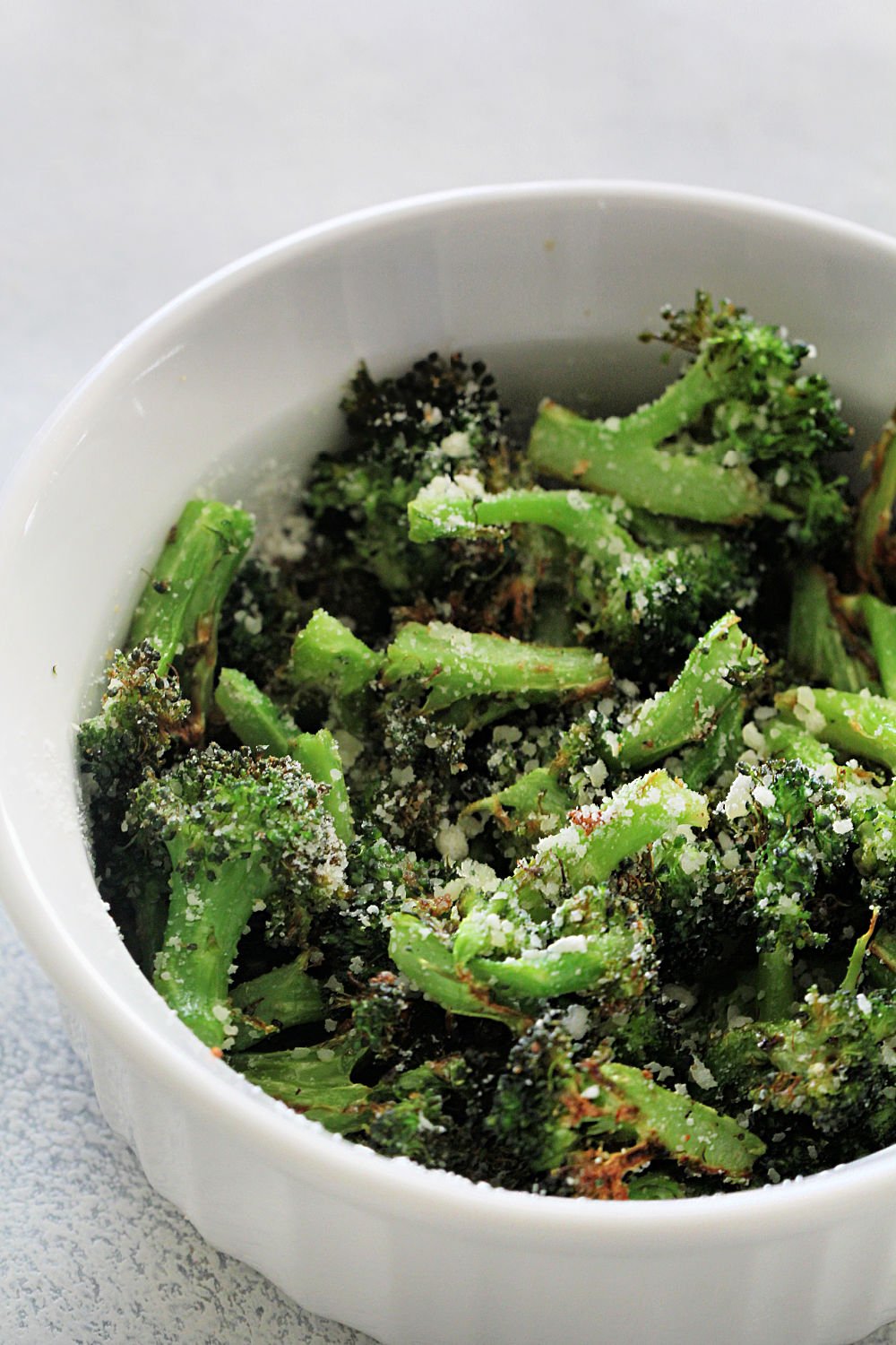 A bowl full of Air Fryer Parmesan Broccoli 