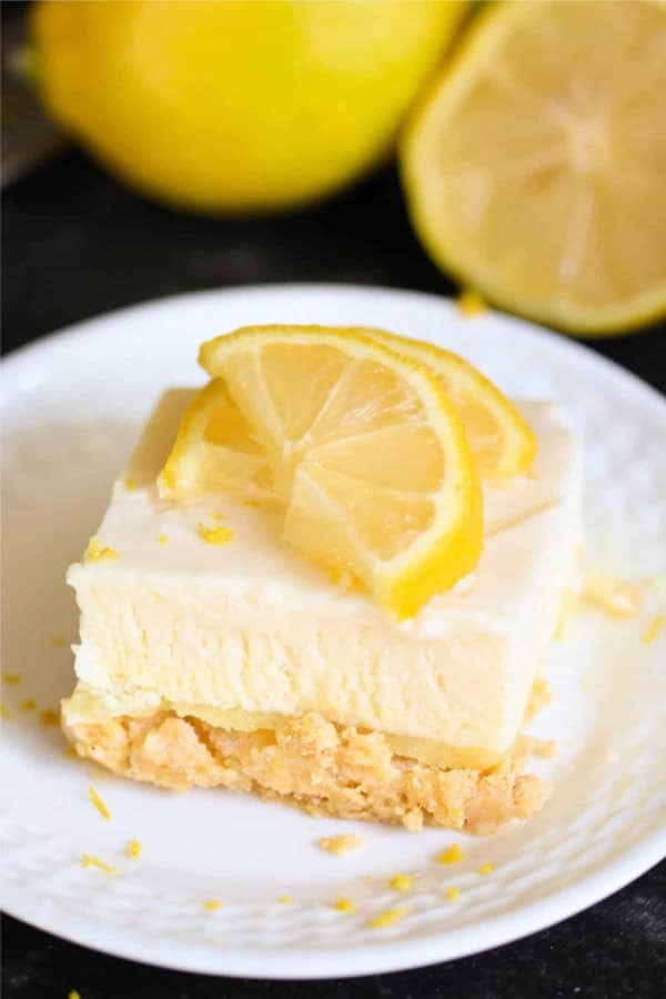 Delicious lemon fluff dessert with fresh lemon slices and creamy texture. Perfect for summer gatheri.