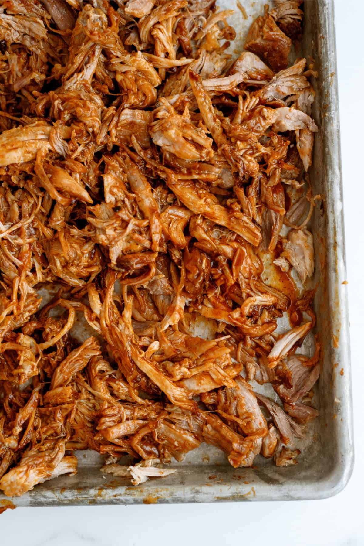 Sheet pan full of shredded bbq pork