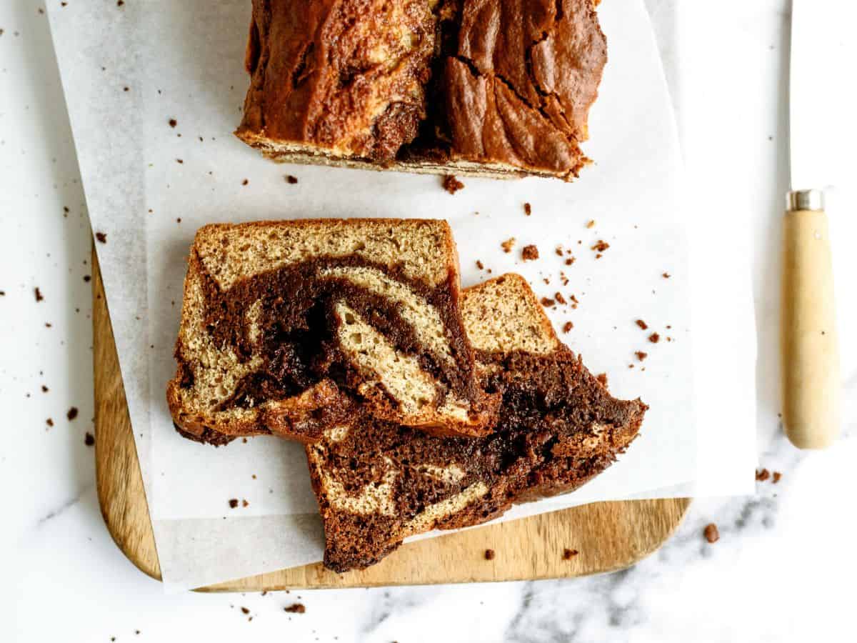 2 slices of Nutella Banana Bread on a cutting board