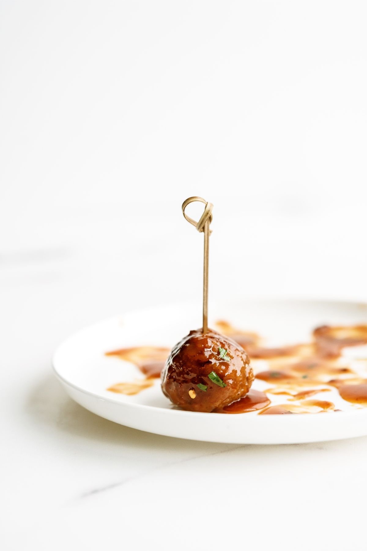 One Slow Cooker Honey Buffalo Meatball on a plate