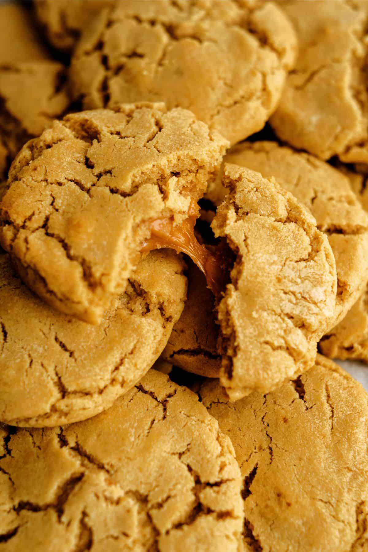 Apple Cider Caramel Cookies with one broken in half to see the caramel