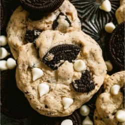 Cookies and Cream Cookies on a dark background with white chocolate chips.