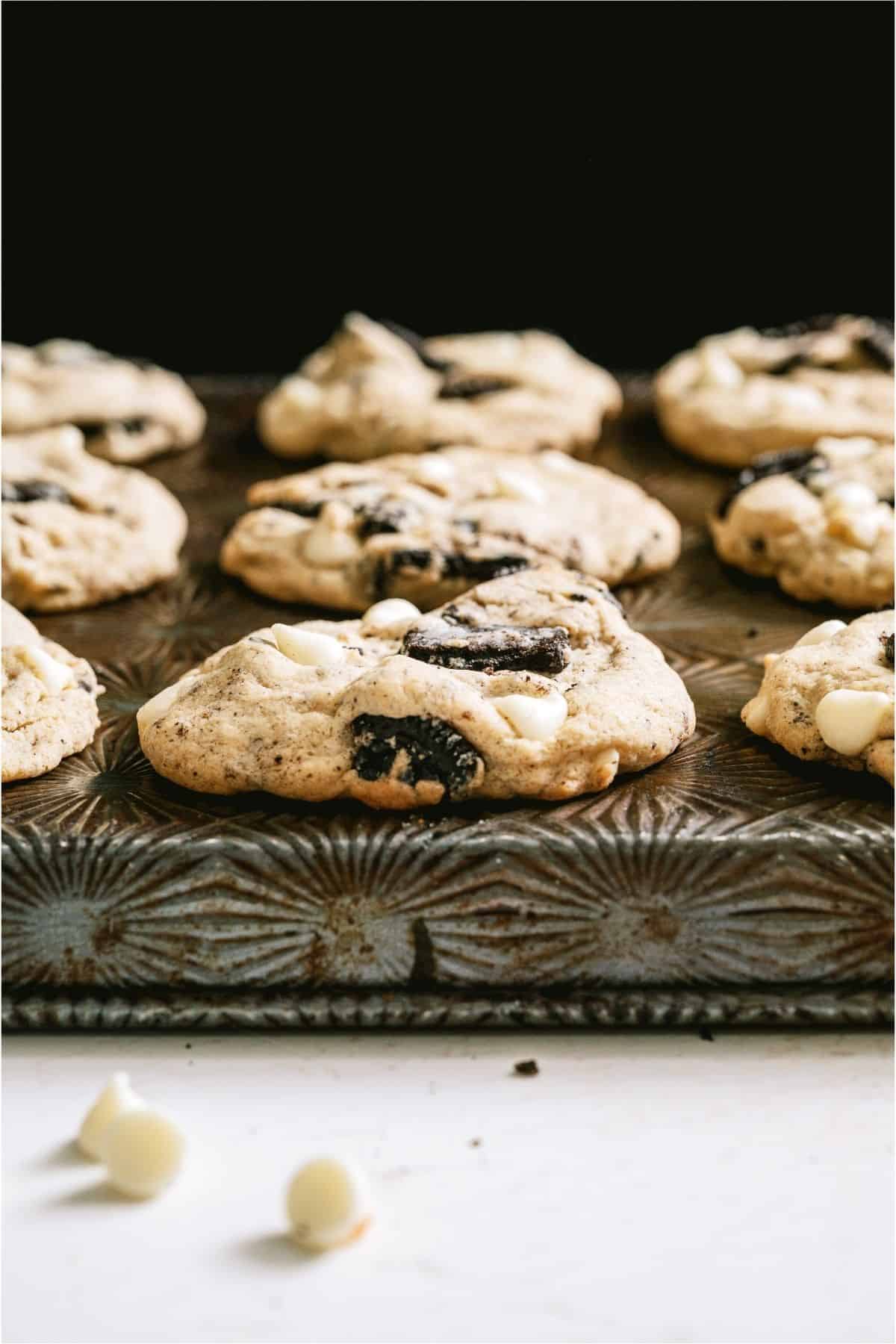 Side view of Cookies and Cream Cookies on a baking sheet.