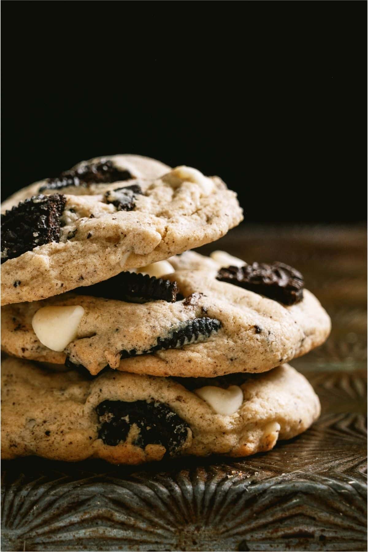 3 Cookies and Cream Cookies stacked on top of each other.