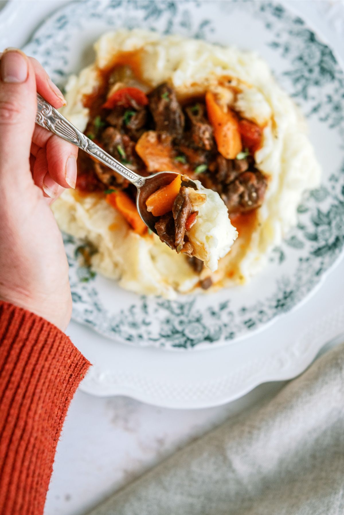 A spoonful of Instant Pot Beef Daube Stew with Mashed Potatoes 