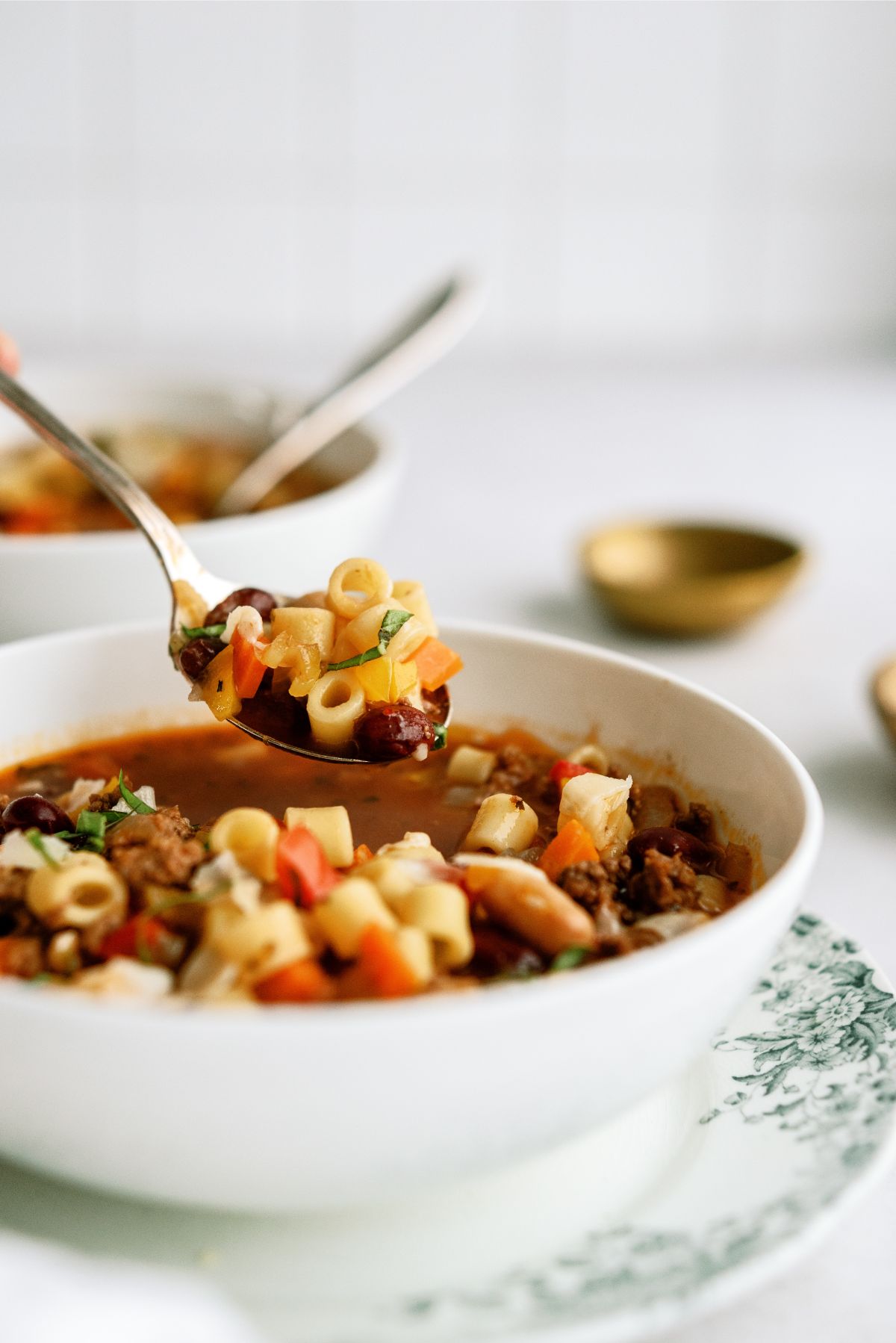 A bowl of Instant Pot Pasta e Fagioli Recipe (Olive Garden Copycat) with a spoon