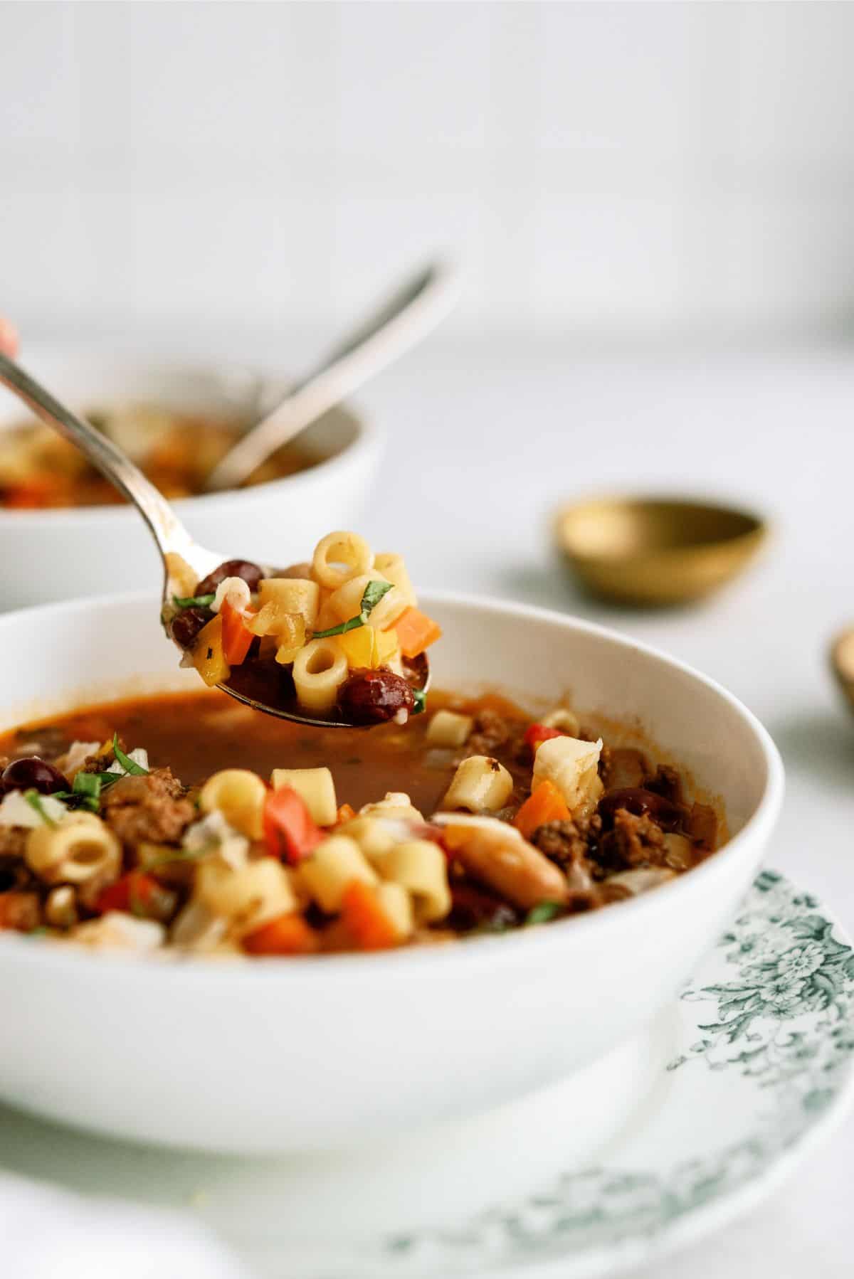 A bowl of Instant Pot Pasta e Fagioli Recipe (Olive Garden Copycat) with a spoon