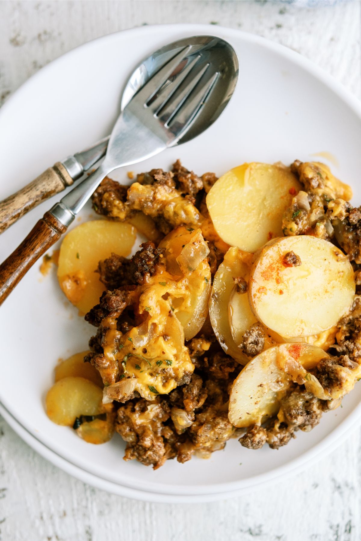 A serving of Slow Cooker Cheesy Beef and Potatoes on a plate