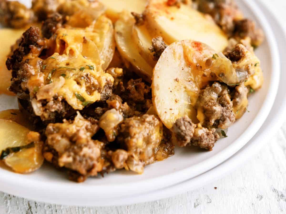 A serving of Slow Cooker Cheesy Beef and Potatoes on a plate