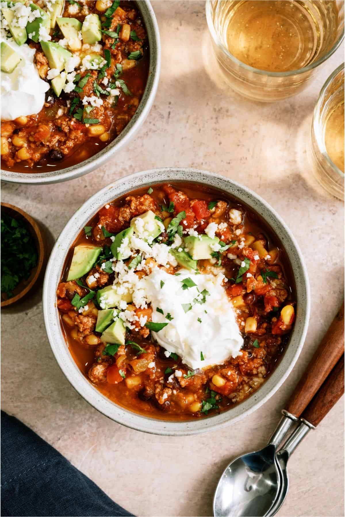 Top view of a bowl of Black Bean Taco Soup with toppings.