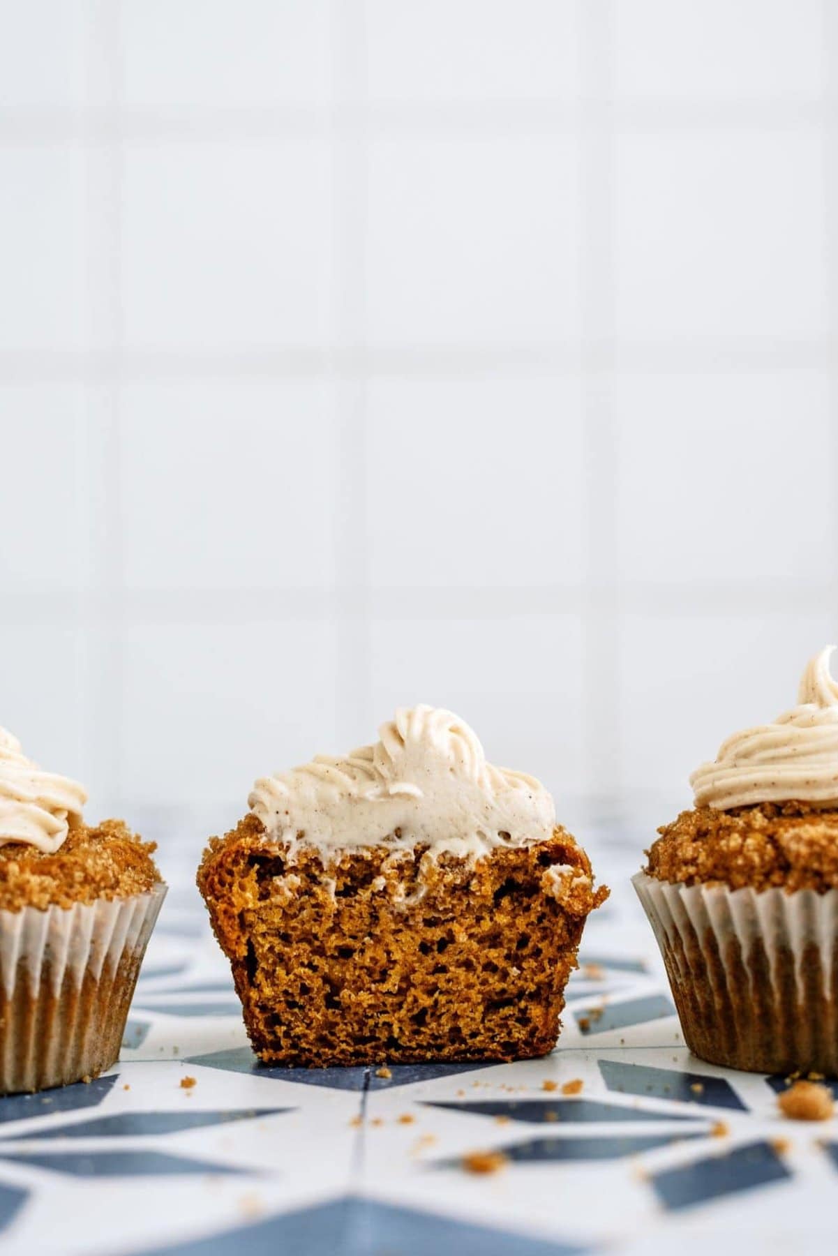 3 Copycat Disneyland Pumpkin Muffins with one unwrapped