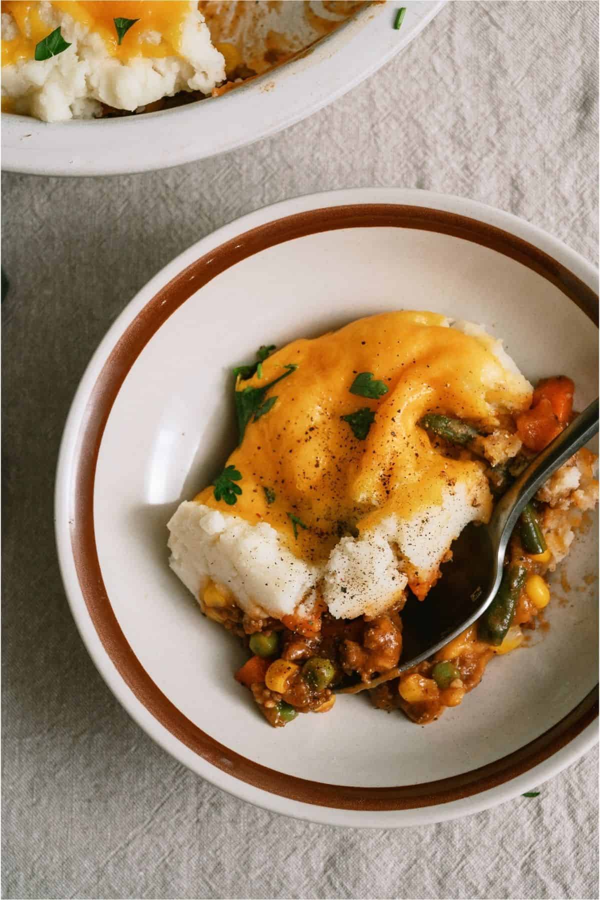 A serving of Ground Beef Shepherd's Pie in a bowl.