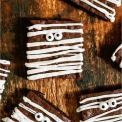 Halloween Mummy Brownies on a wooden background.
