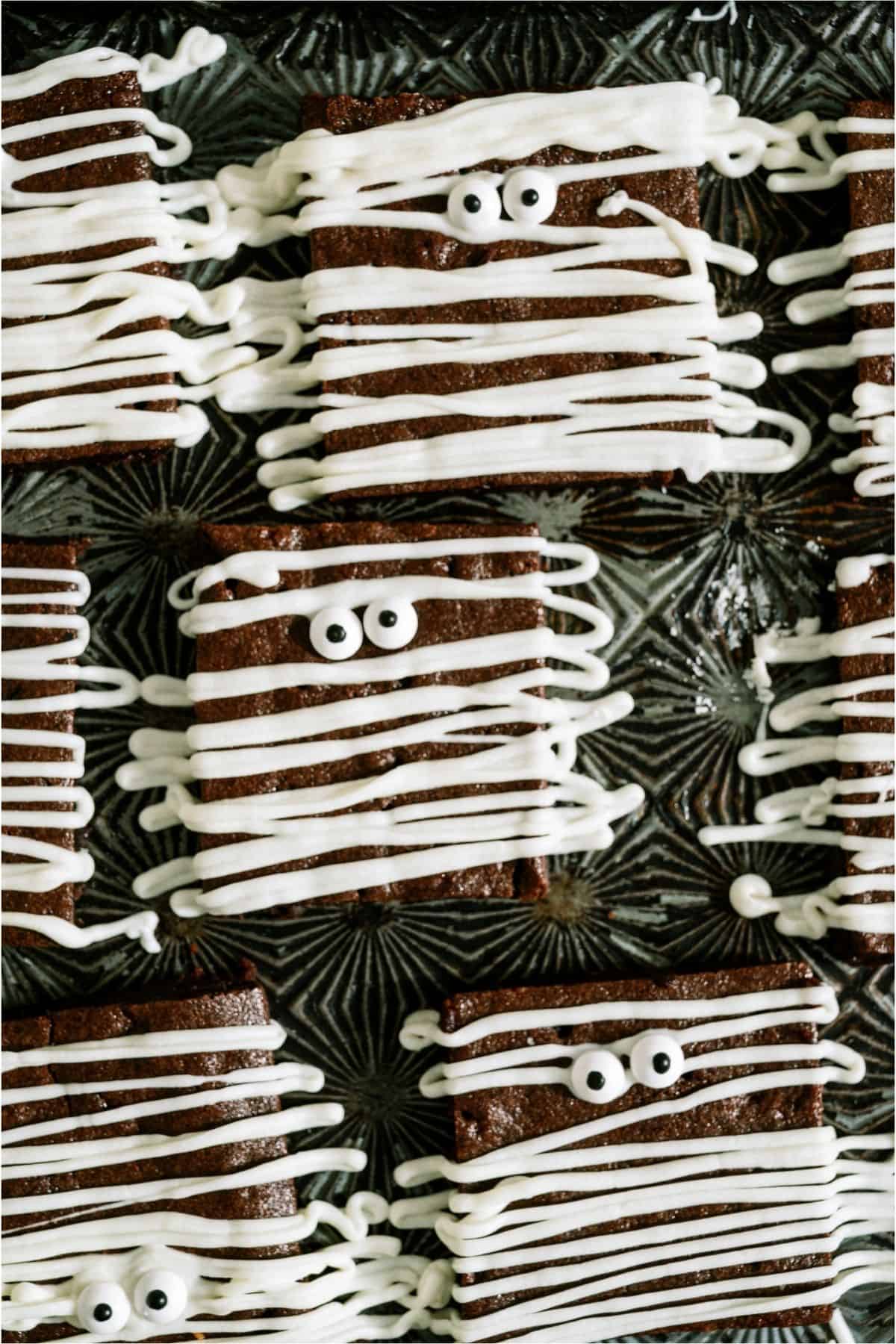 Halloween Mummy Brownies on a black background.