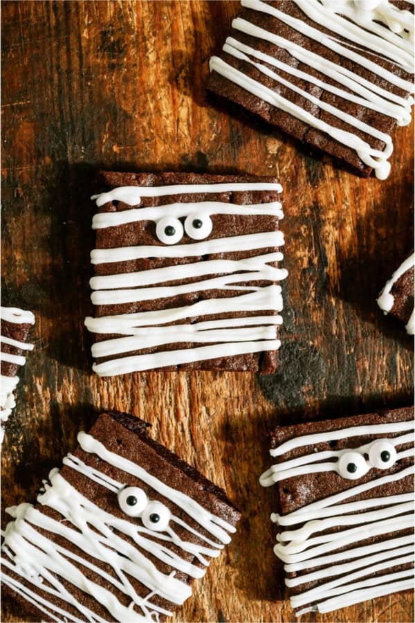 Halloween Mummy Brownies on a wooden background.