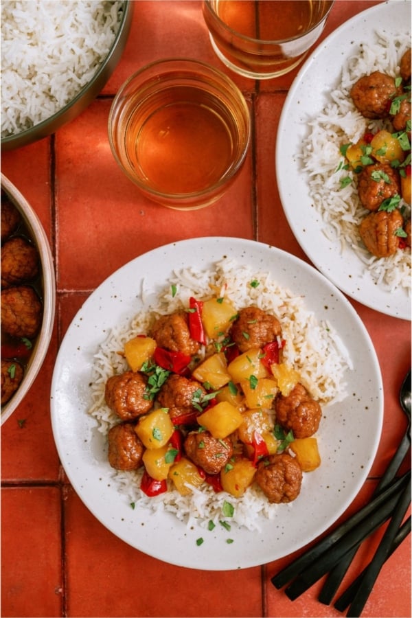 Top view of Instant Pot Hawaiian Meatballs served over rice on a plate.