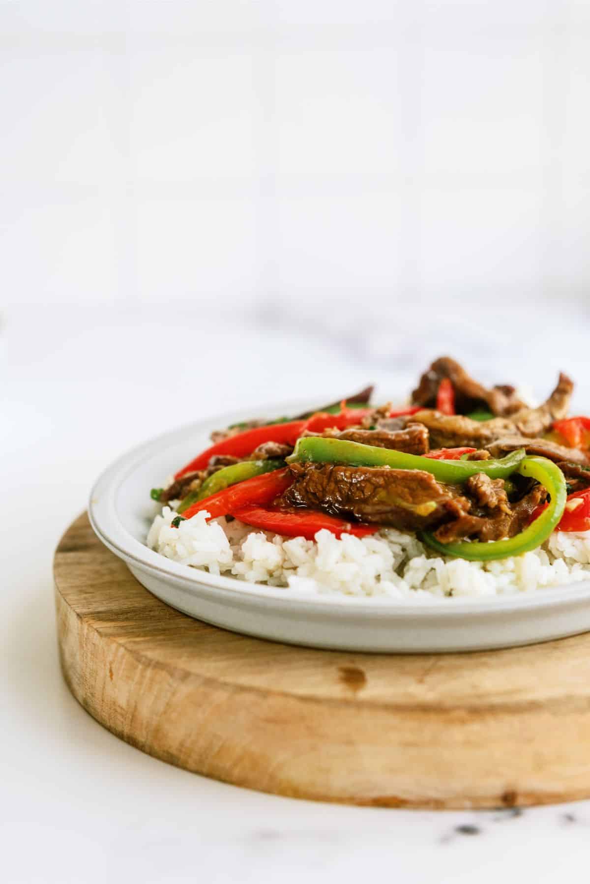 A serving of Instant Pot Pepper Steak Recipe with Rice on a plate