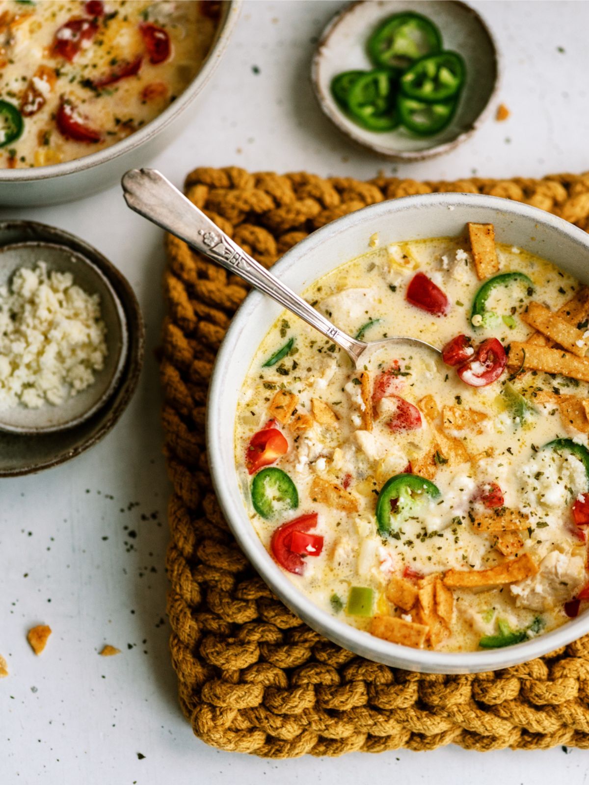 Mexican Cheesy Chicken Corn Chowder in a bowl with toppings