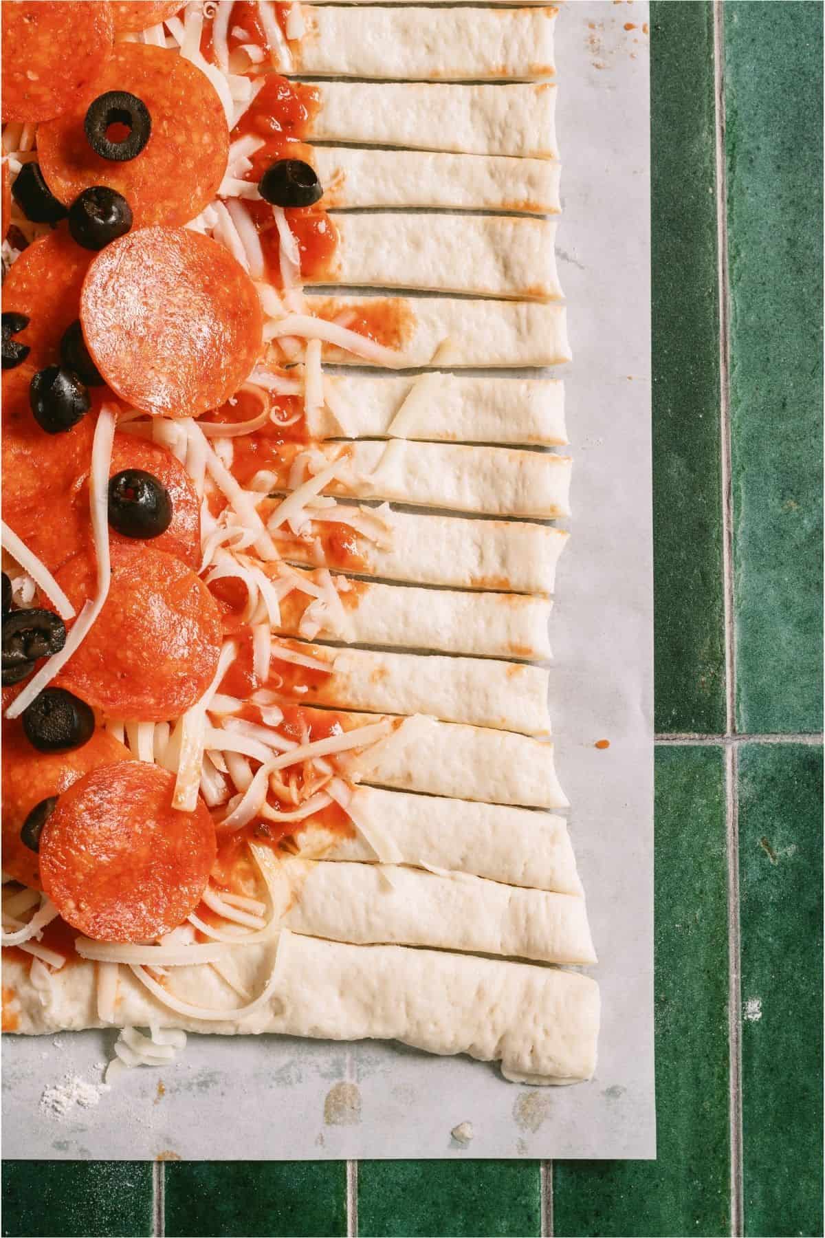 Pizza dough edges cut into strips.