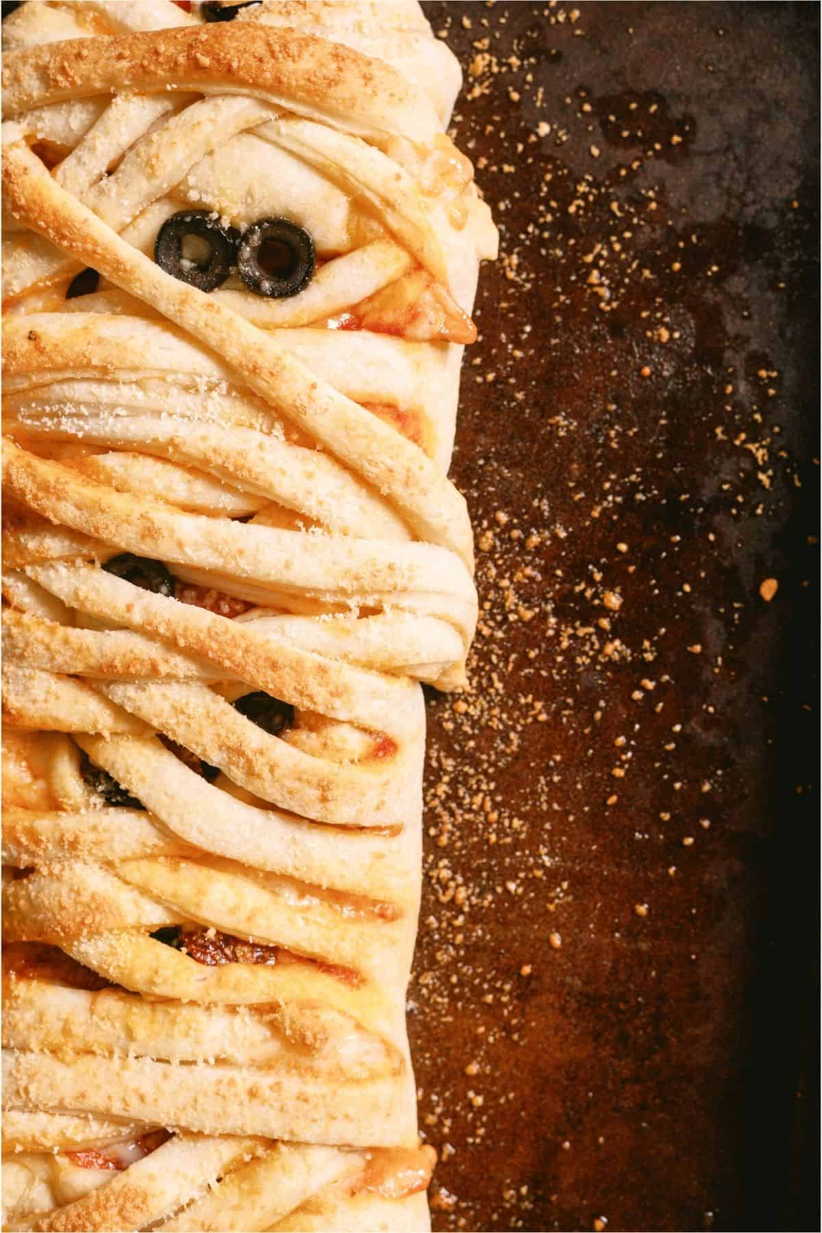 Mummy Pizza Braid on a sheet pan.