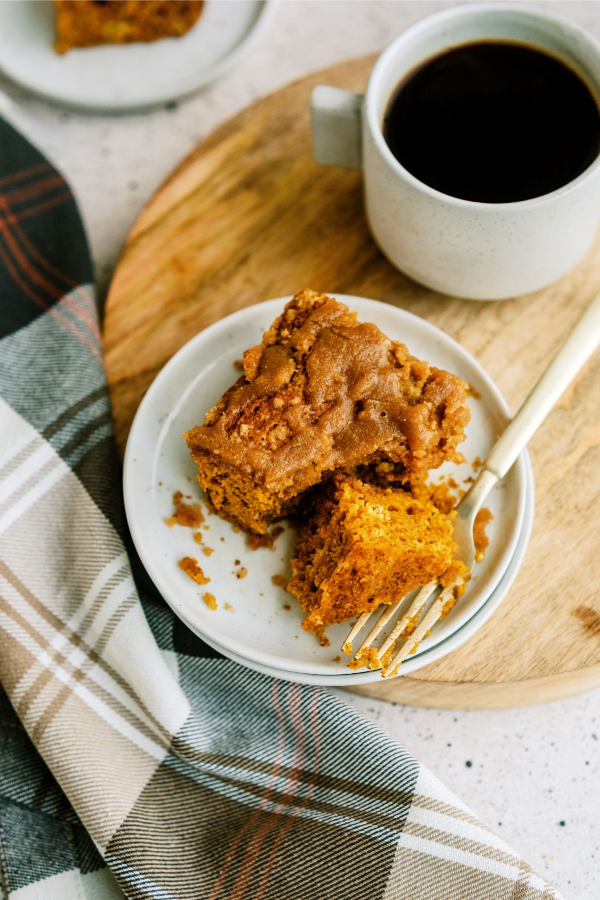A slice of Pumpkin Coffee Cake with Brown Sugar Glaze on a plate 