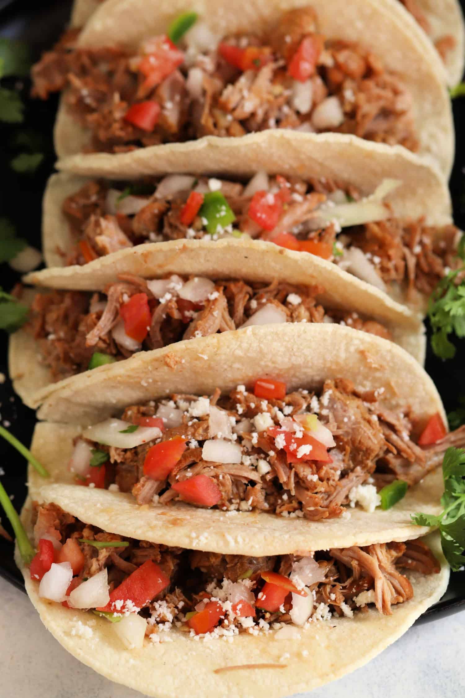 Slow Cooker Pork Carnitas topped with pico