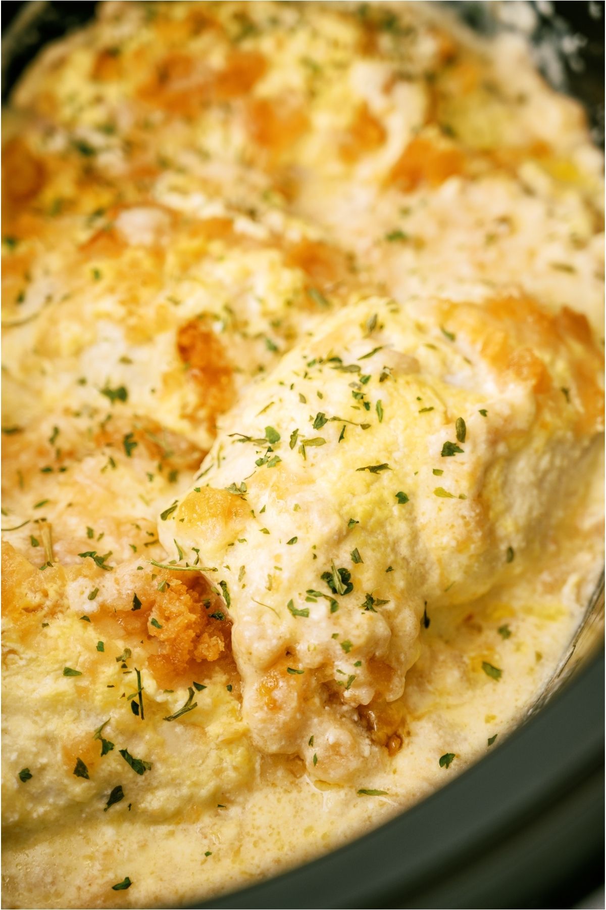 Close up of cooked Slow Cooker Ritz Chicken in the slow cooker.