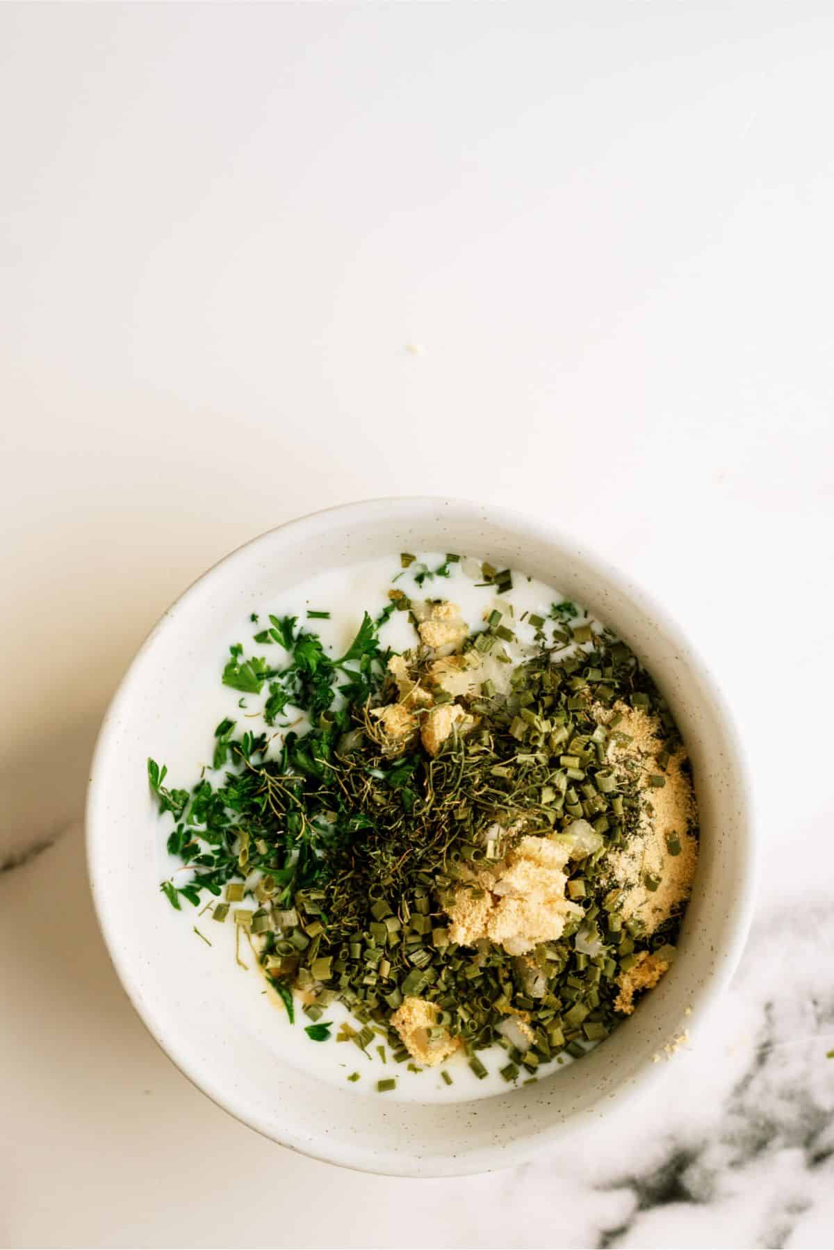 Ingredients for Homemade Ranch Dip in a small bowl