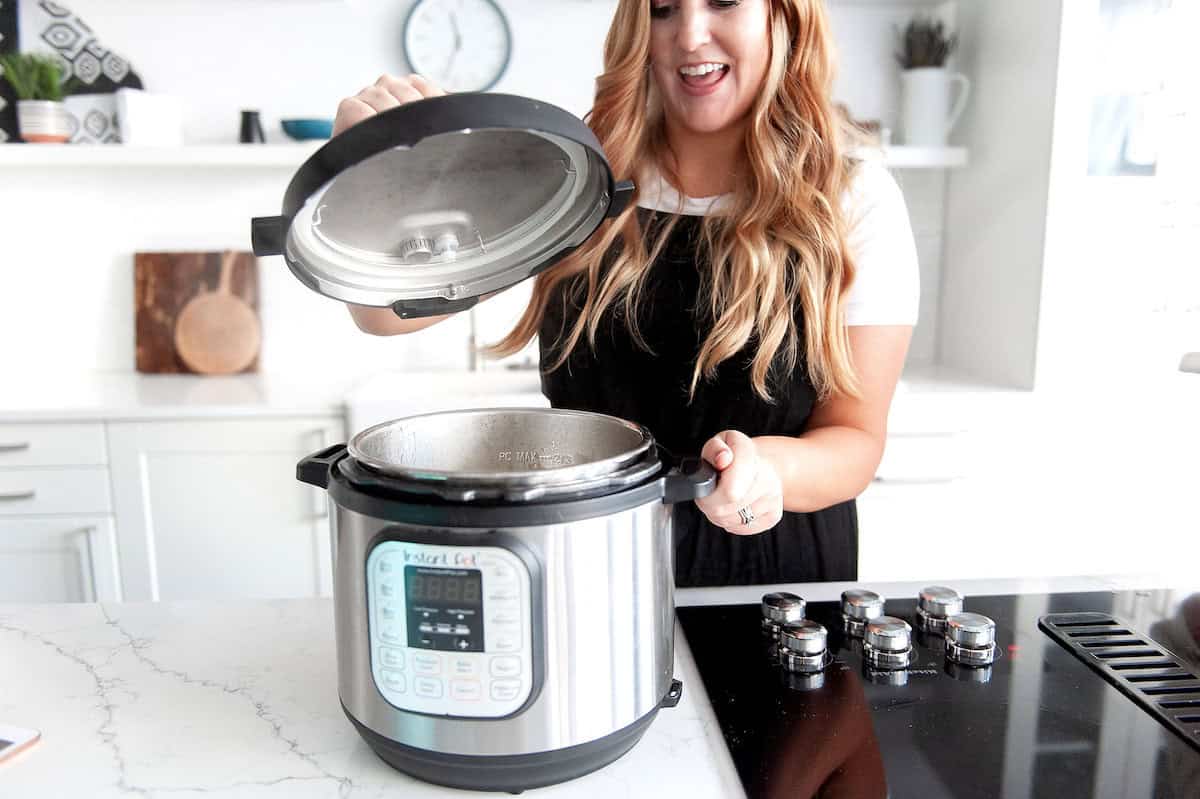 steph checking her freezer meal in the instant pot