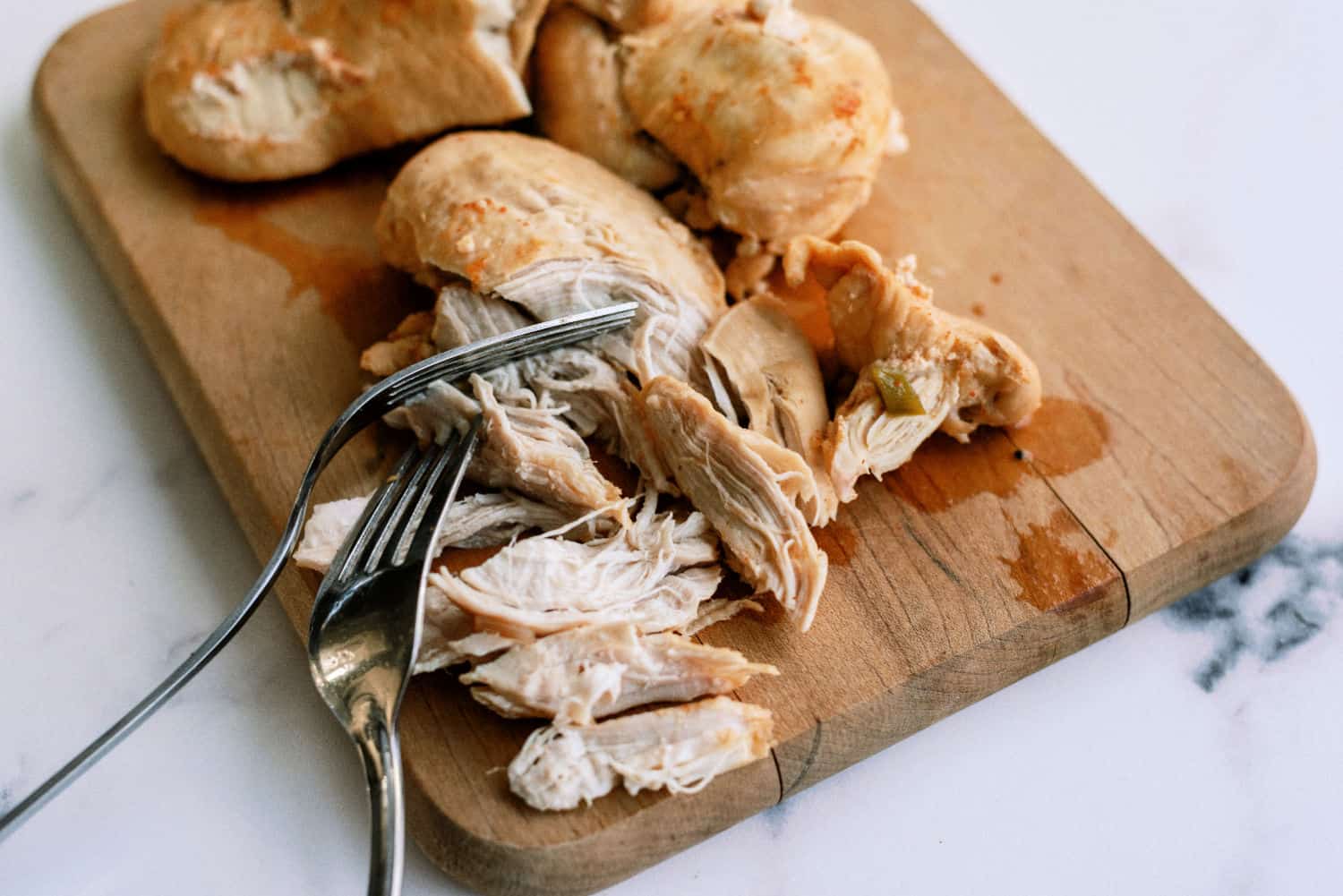 Cooked Chicken breast on a cutting board