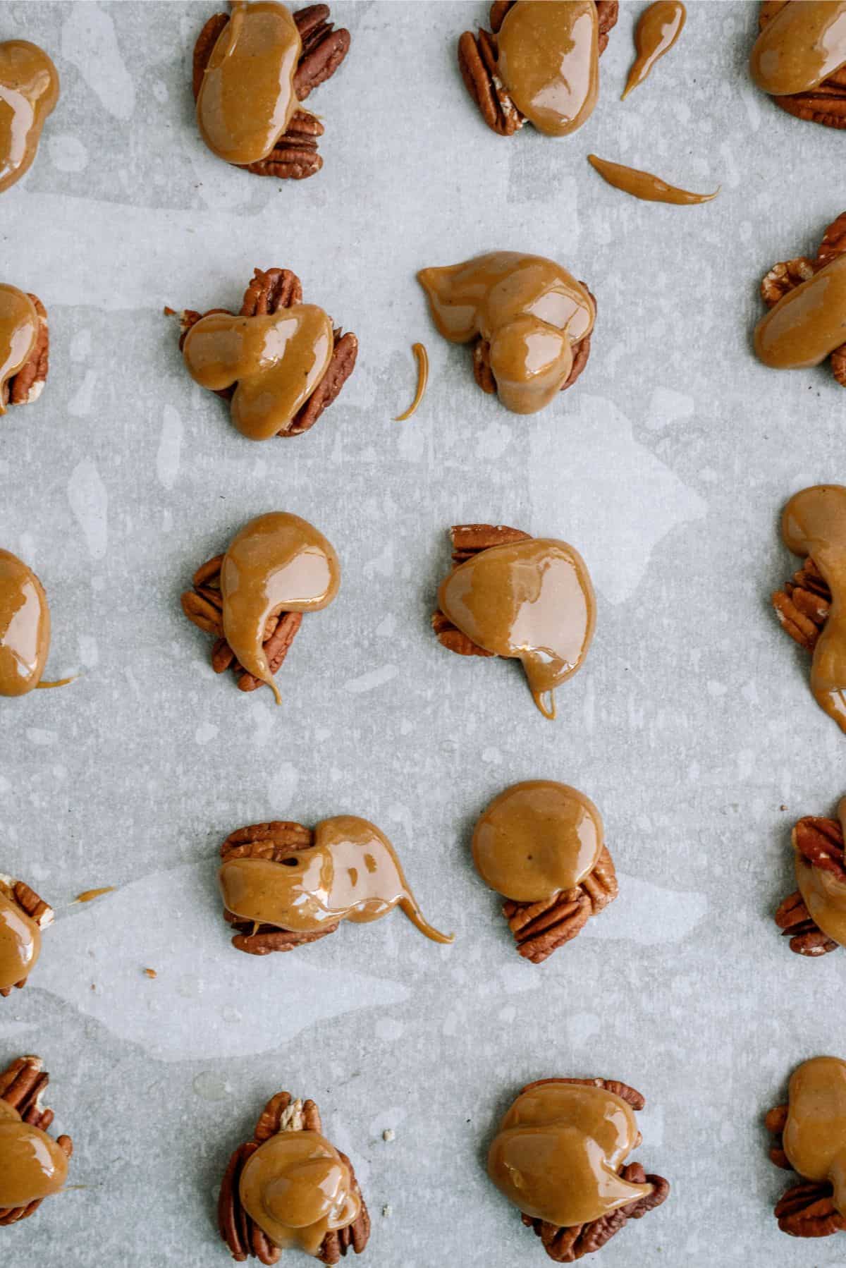 Caramel dropped by Tablespoons onto grouped pecans