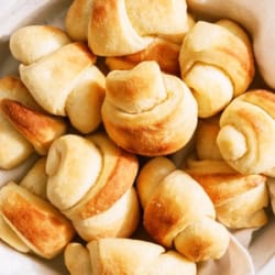 Top view of a basket full of Freshly Baked Easy Homemade Rolls.