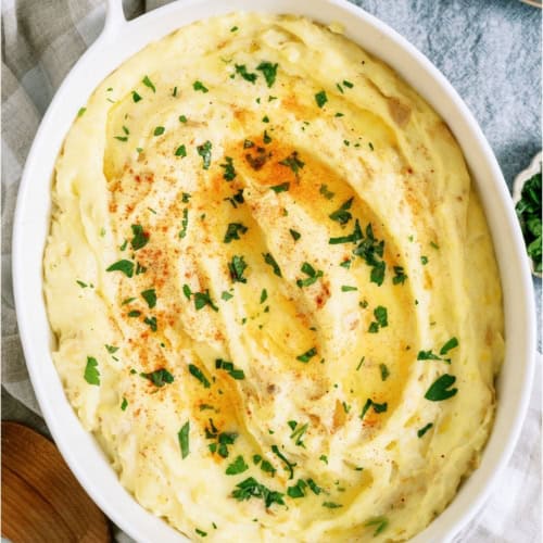 Make-Ahead Mashed Potatoes in a white casserole dish.