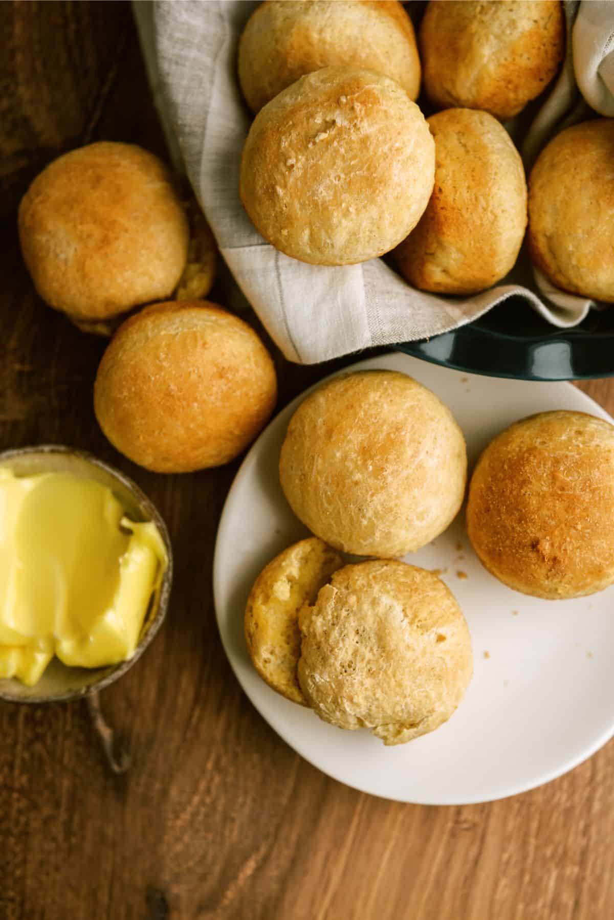 Top view of No Knead Honey Wheat Dinner Rolls with butter