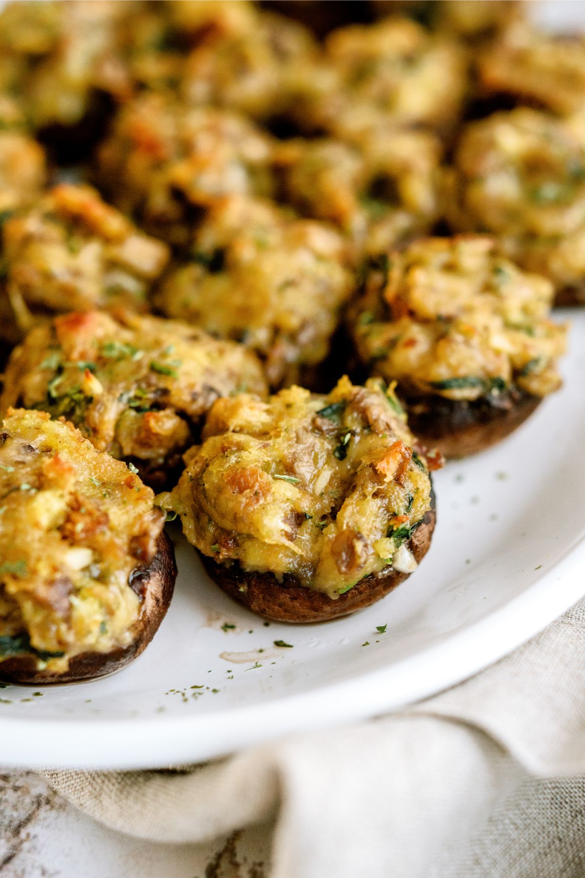 Close up of Parmesan Spinach Stuffed Mushrooms on a serving plate