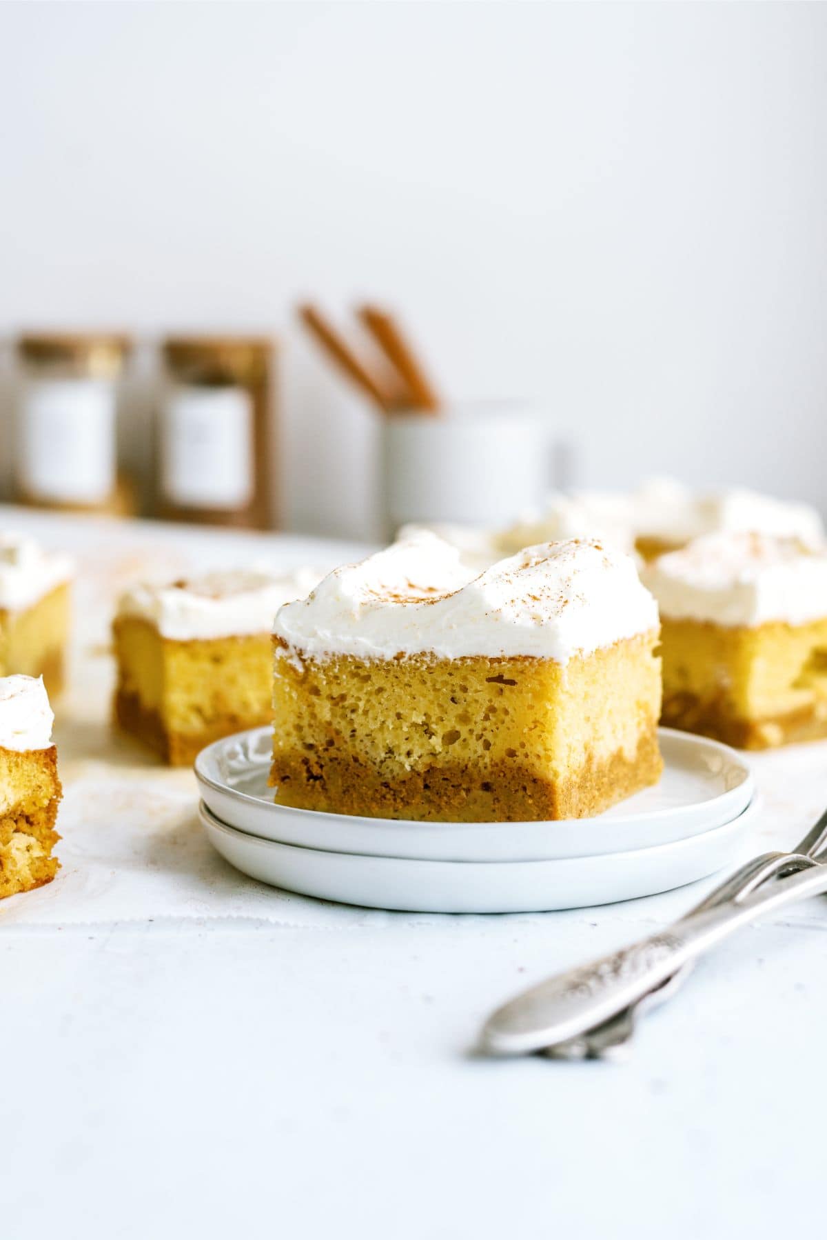 A square of Pumpkin Layered Magic Cake  on a plate