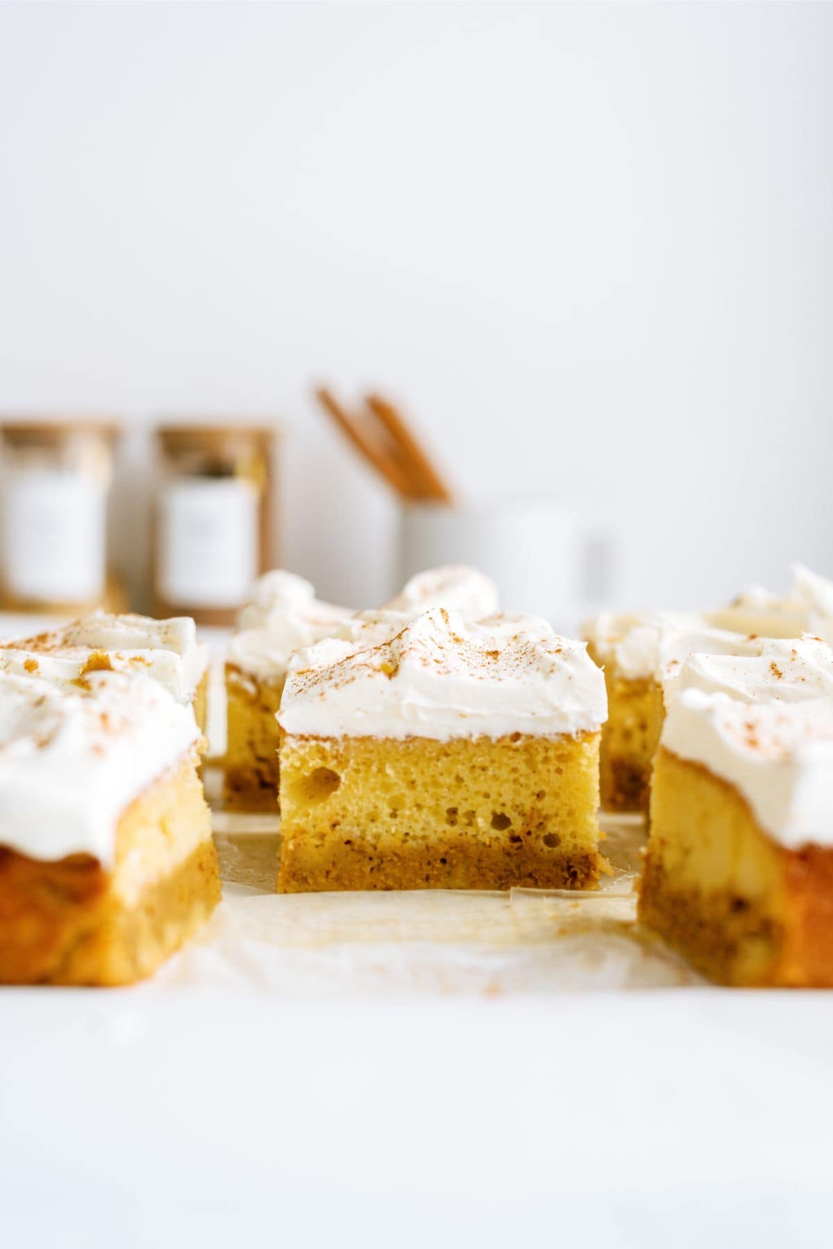 Side view of Pumpkin Layered Magic Cake cut into squares