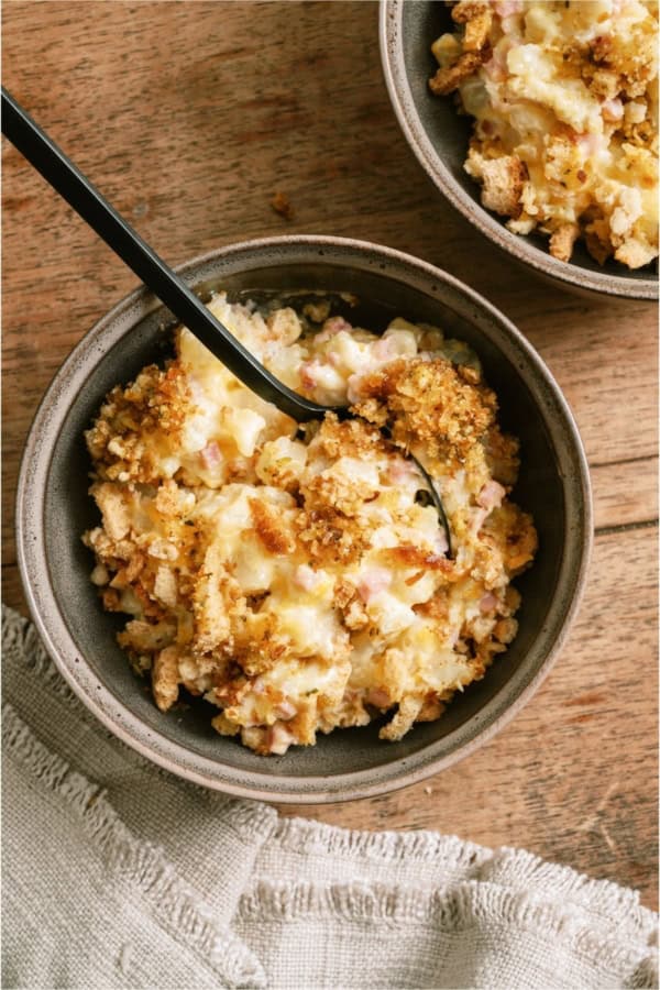 Top view of a bowl with a serving of Slow Cooker Ham and Potato Casserole inside.