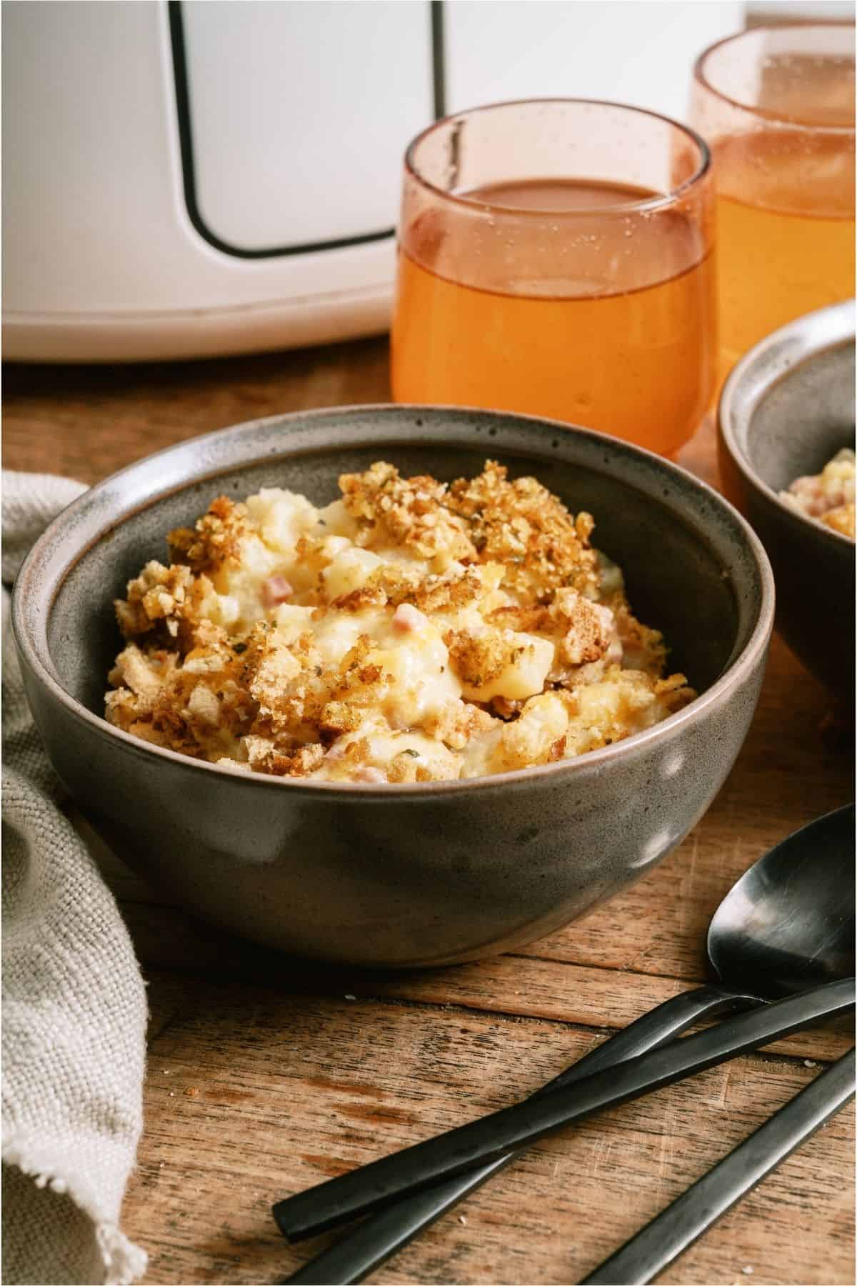 A serving of Slow Cooker Ham and Potato Casserole in a bowl.