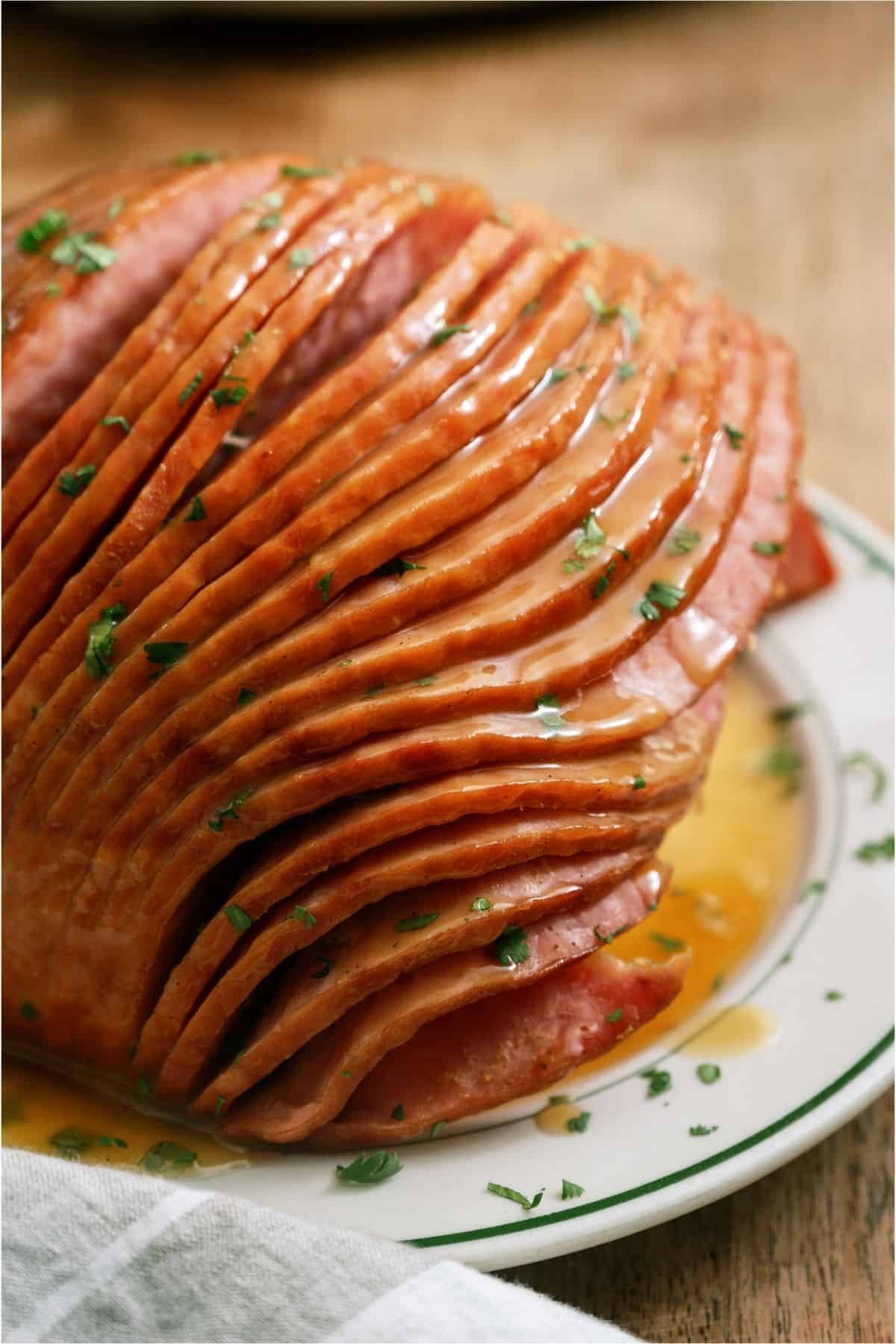 Close up of Slow Cooker Honey Baked Ham on a plate.