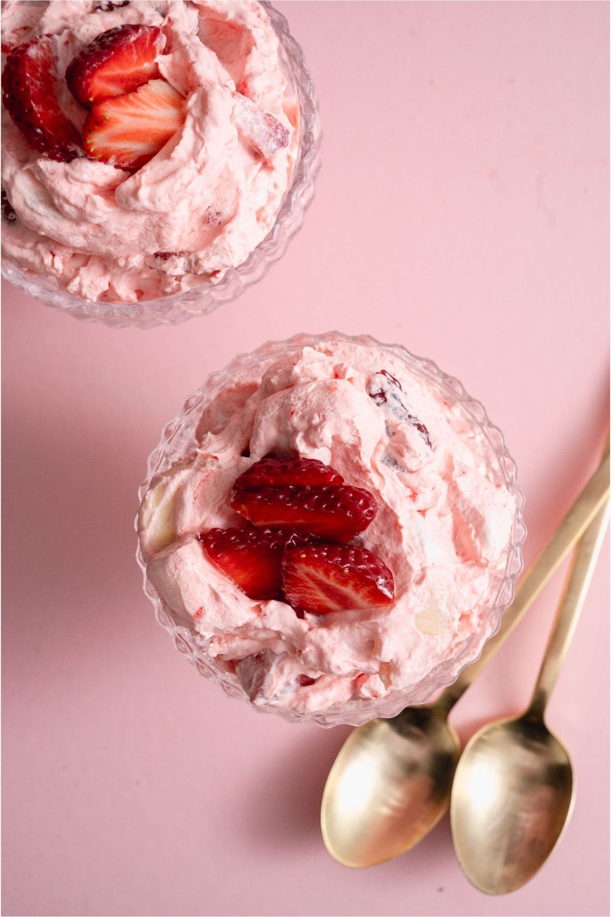 Top view of a cup with a serving of Strawberry Jello Fluff Salad.