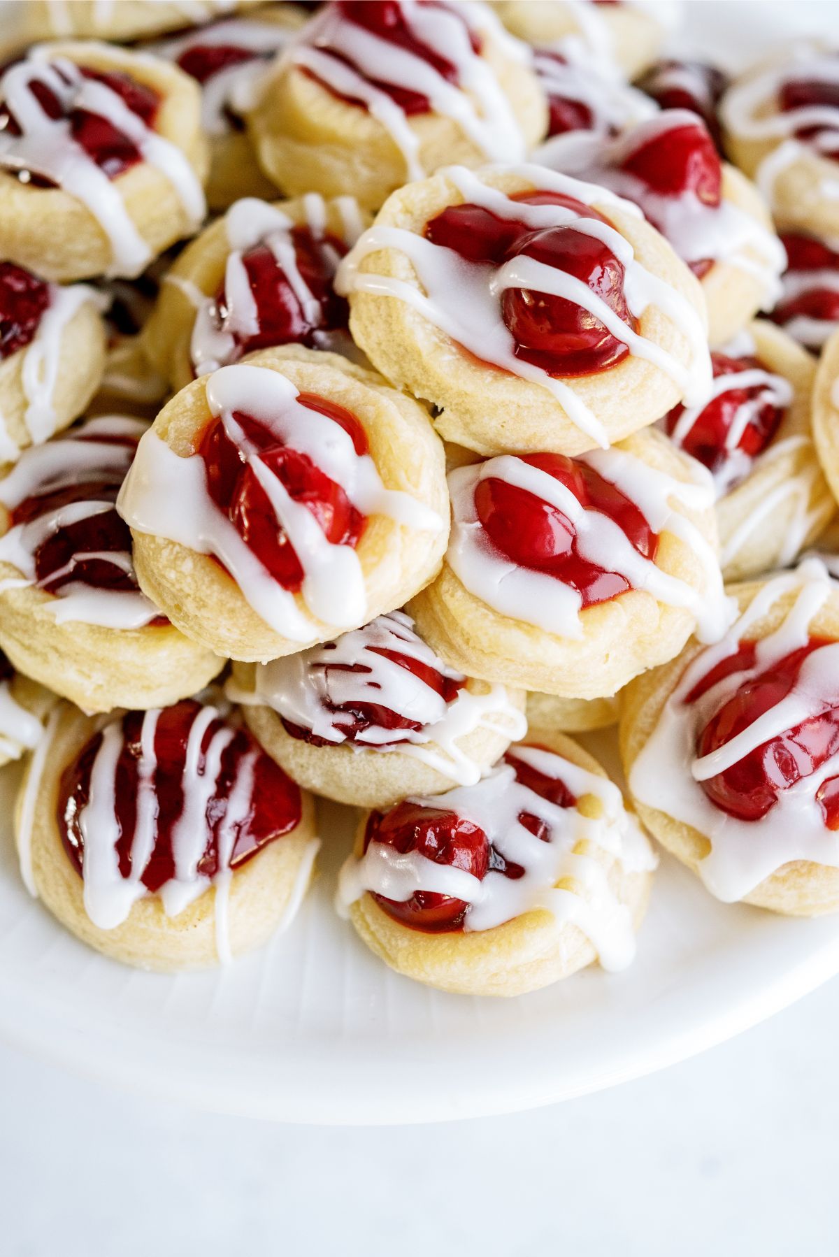 Close up of Cherry Danish Cookies on a cake stand